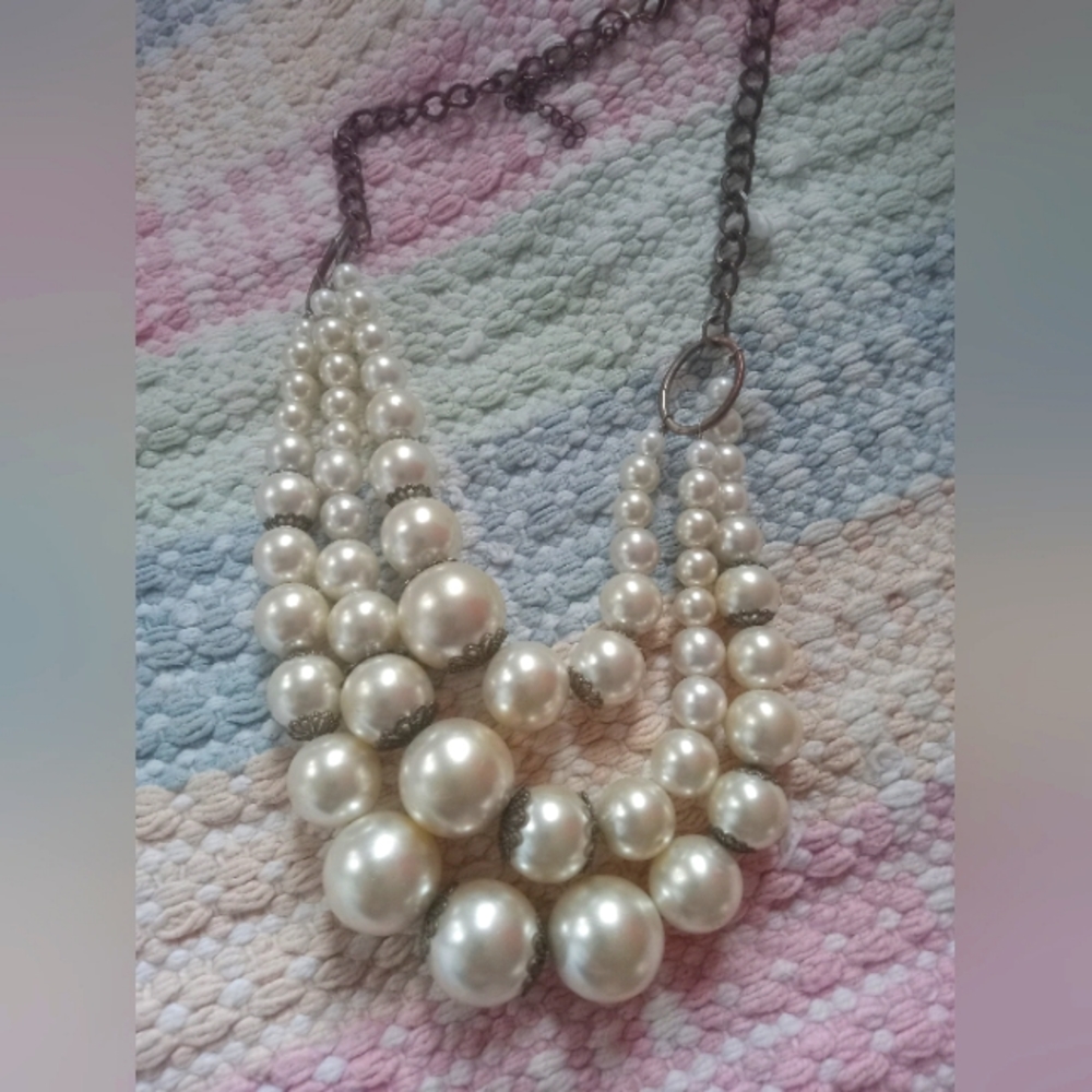 A white plastic pearl necklace